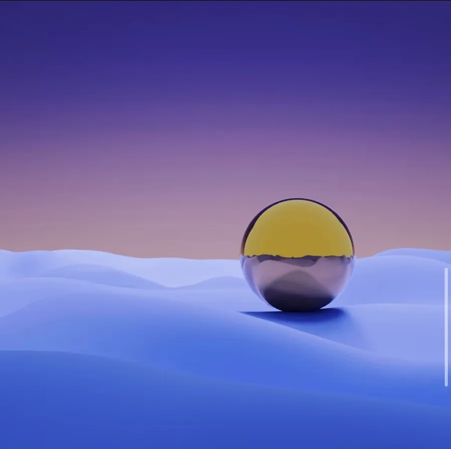 Eine spiegelnde Kugel auf weichen blauen Dünen